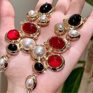 Elegant Gold-Tone Necklace with Red, Black and Pearl Cabochons